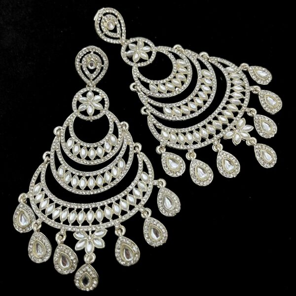 Advertisement Stone Moon Earrings German Silver Plating Silver Color and Studded with Cubic Zirconia/American Diamonds and Made in India