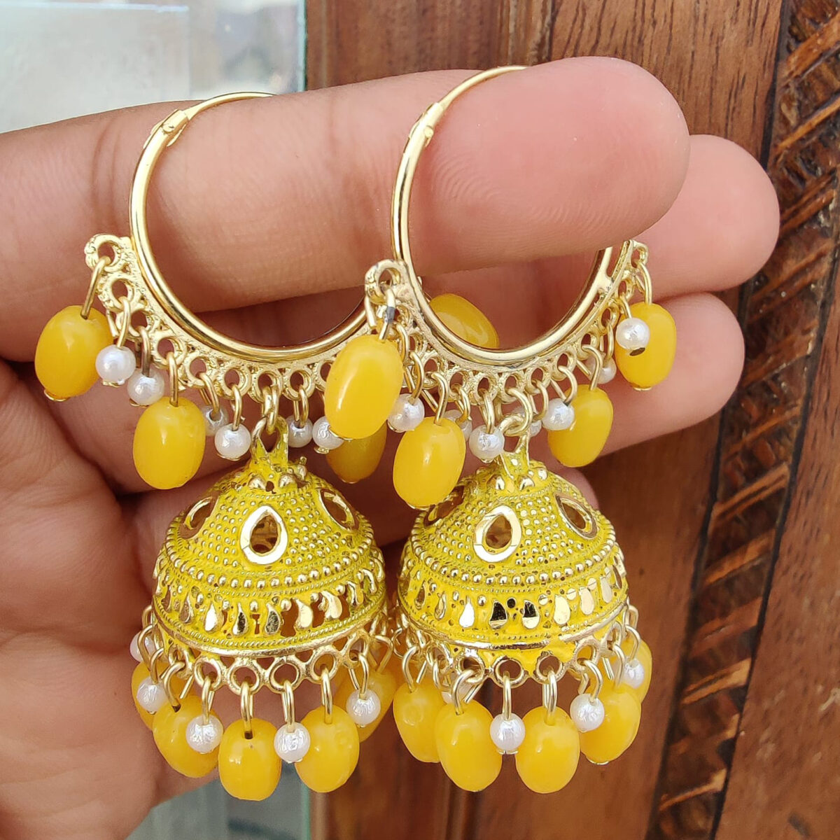 Jhumki is made of beautiful designer Meenakari using alloy and gold plated and decorated with yellow coloured pearls.