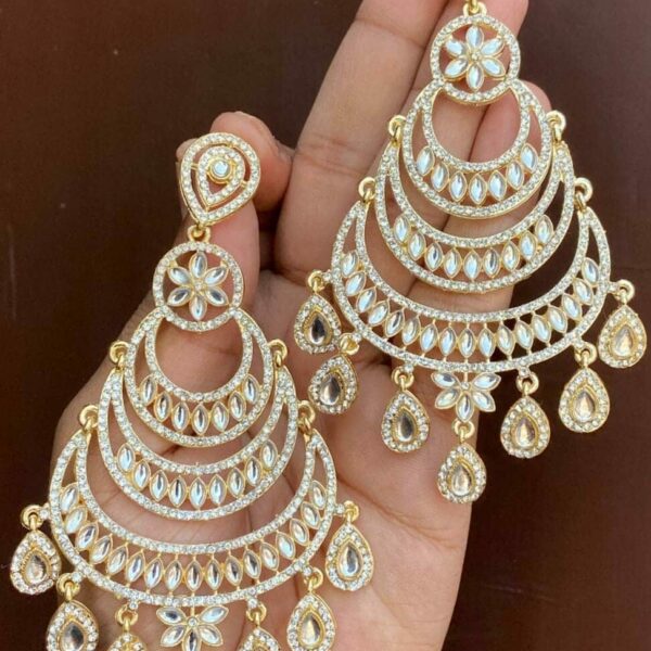 Beautiful kundan earrings which are made of alloy material with a silver Plated on them. embellished with artificial stones and beads