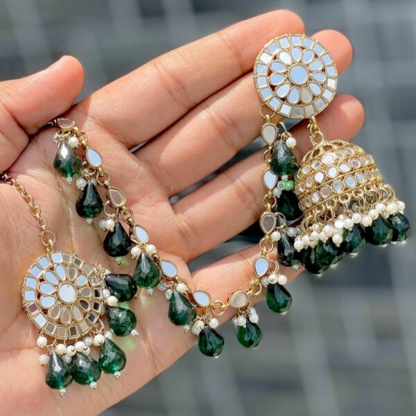 British green earrings with beautiful tika made of kundan beads and the material is alloy