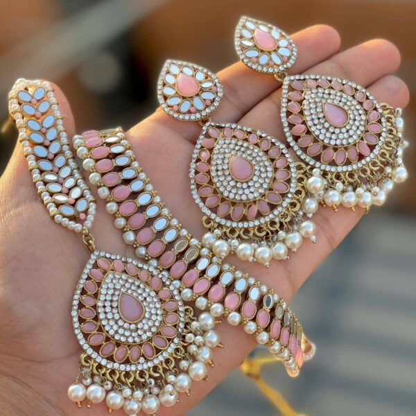 Melon pink necklace and earring and tikka set, made by Kundan Pearls, a mirror and layer brass, copper and gold plated top