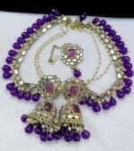 purple munsell pearls mirror earrings with beautiful tika made of kundan beads and the material is alloy