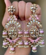 cupid pink Mehendi Polish Pachi Kundan Long Earrings having base metal alloy and gold plated with artificial Kundan stones and pearls, adjustable and made in India. which is held in hands and presented