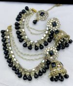 Black earrings with beautiful tika made of kundan beads and the material is alloy